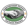 Logo Tierheimprojekt und JA Hameln Hand und Pfote geben sich die Hand